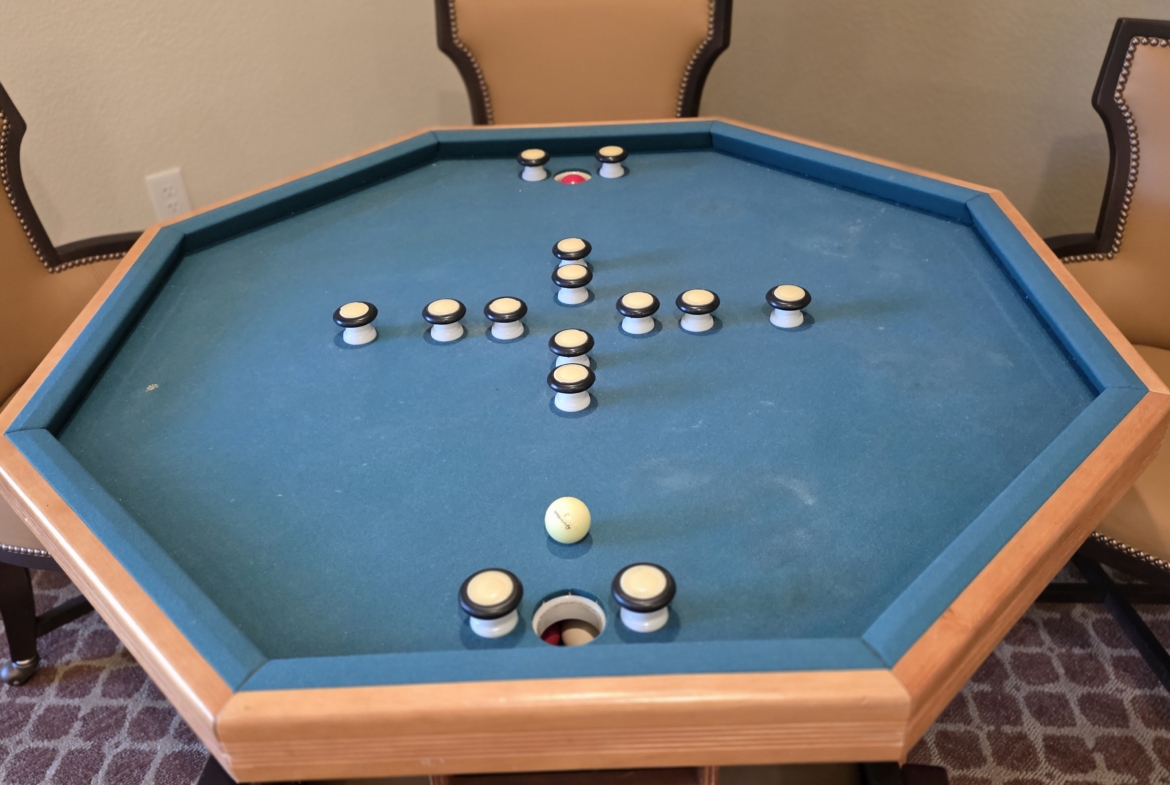 Hexagonal table with pegs and holes.